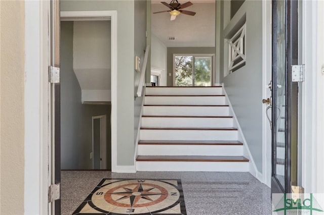 stairs with ceiling fan