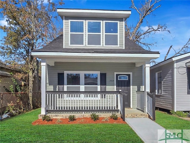 view of front of property featuring a front lawn and a porch