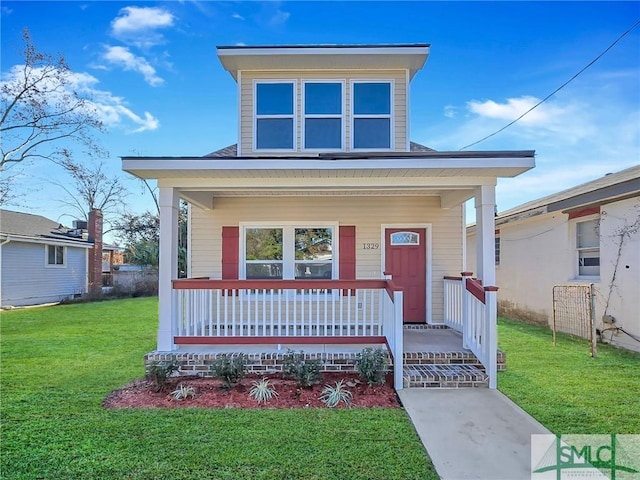 view of front of home featuring a porch and a front yard