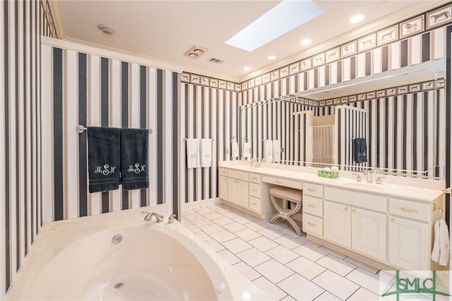 bathroom with tile patterned floors, a skylight, ornamental molding, vanity, and a tub