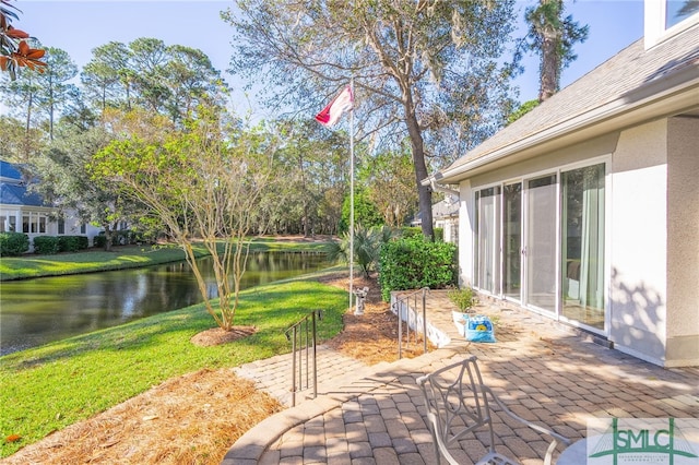 view of patio featuring a water view