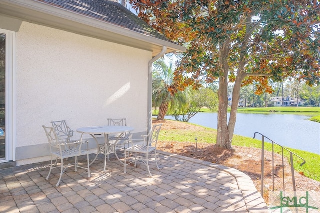 view of patio / terrace featuring a water view