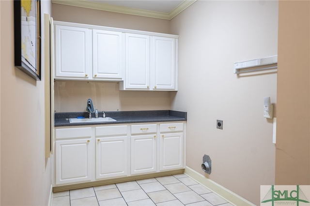 laundry room featuring cabinets, ornamental molding, hookup for an electric dryer, and sink