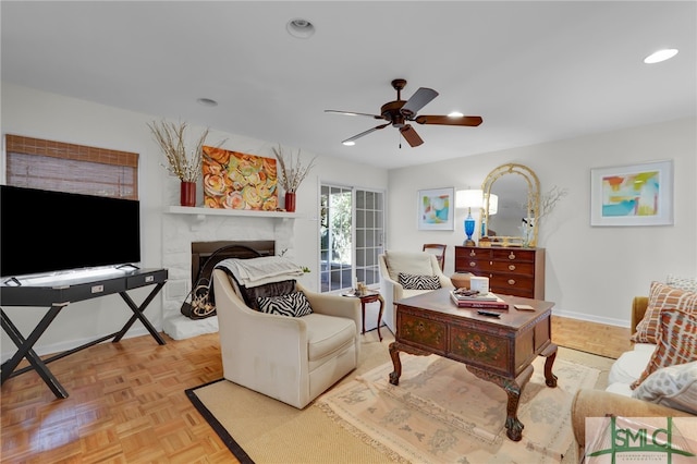 living room with light parquet floors and ceiling fan