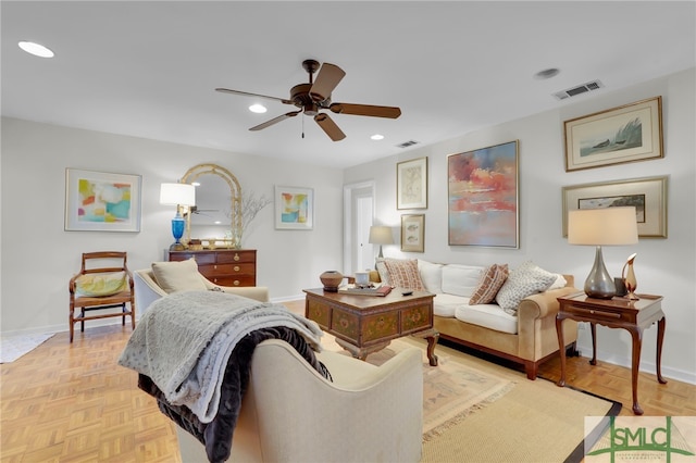 living room with light parquet floors and ceiling fan