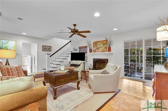 living room featuring ceiling fan and light parquet floors