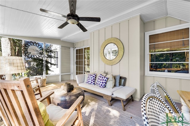 exterior space with ceiling fan and an outdoor living space