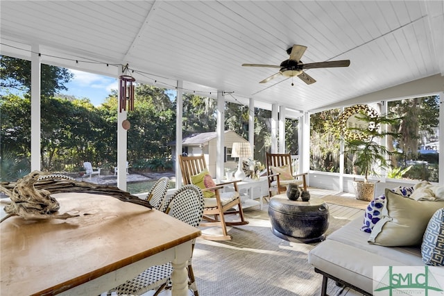 sunroom with ceiling fan, lofted ceiling, and wood ceiling