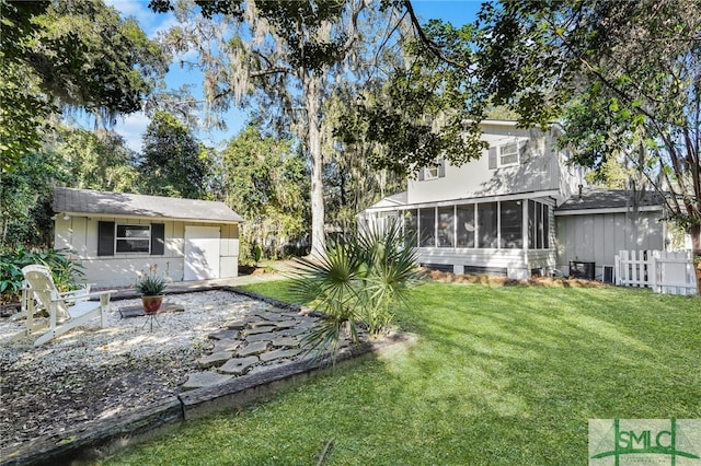 view of yard featuring a sunroom