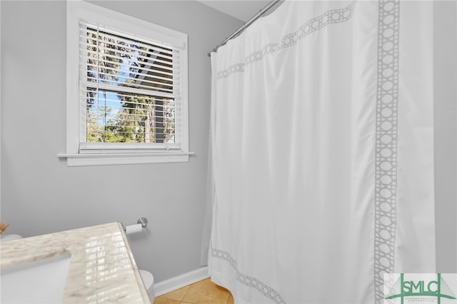 bathroom featuring tile patterned flooring and vanity