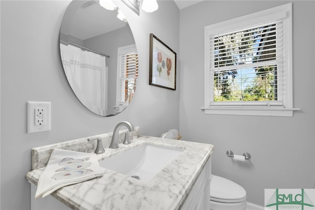 bathroom with vanity and toilet