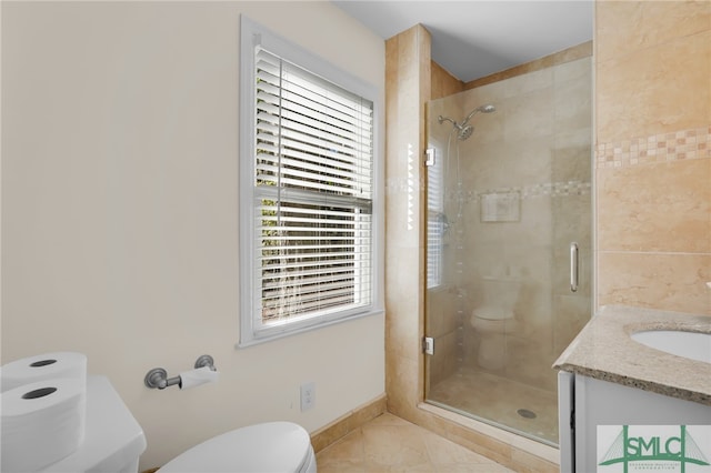 bathroom with walk in shower, toilet, and a wealth of natural light