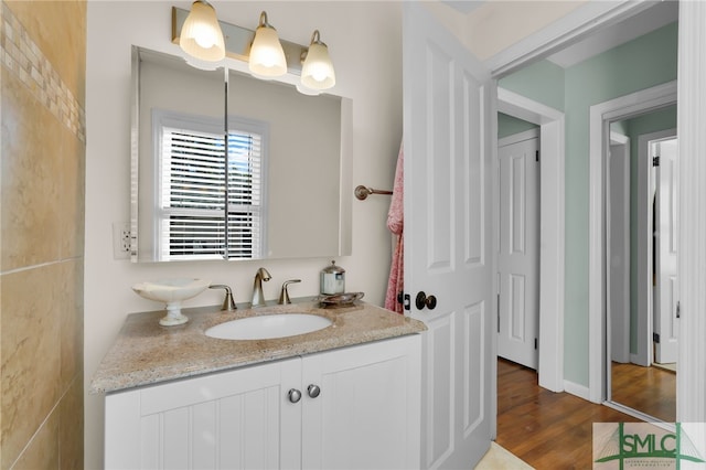 bathroom featuring vanity and hardwood / wood-style flooring