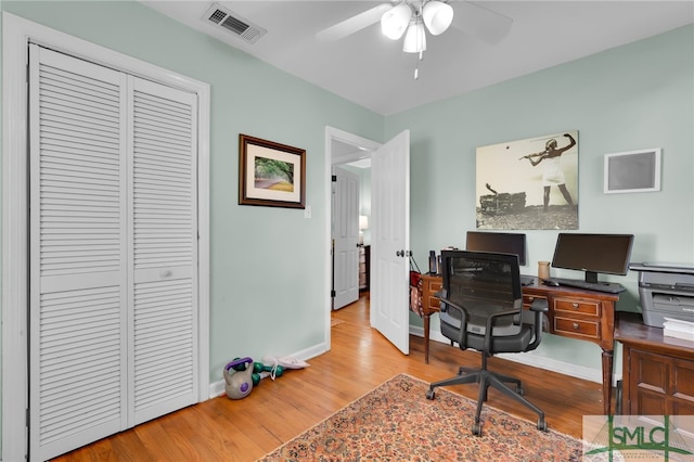 office area with ceiling fan and light hardwood / wood-style floors