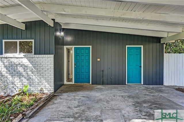 doorway to property with a patio area