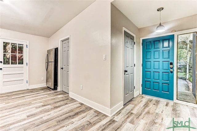 foyer with light wood-type flooring