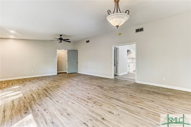 unfurnished room featuring ceiling fan and light wood-type flooring