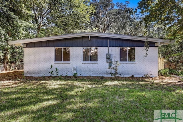 view of property exterior featuring a lawn