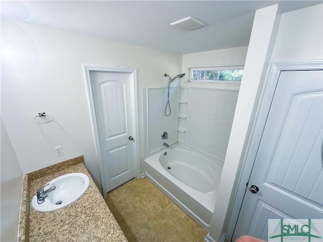 bathroom with tile patterned floors, vanity, and bathing tub / shower combination