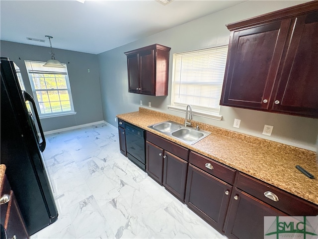 kitchen with black appliances, hanging light fixtures, sink, and a wealth of natural light