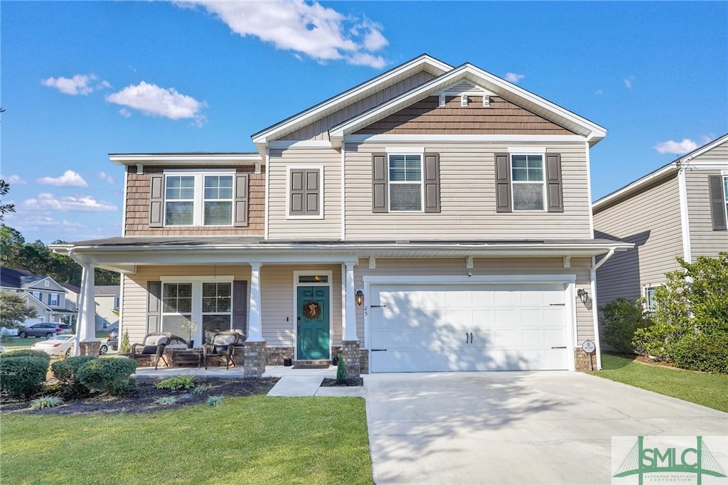 craftsman-style home with a porch, a garage, and a front lawn