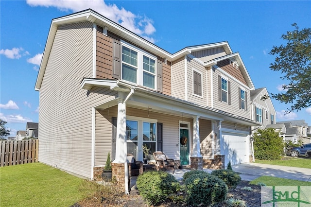 view of front of house with a porch and a garage