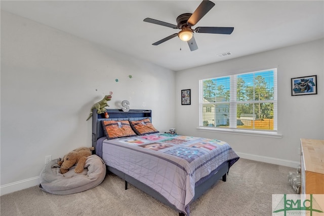 carpeted bedroom with ceiling fan