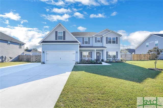 view of front of property featuring a garage and a front lawn