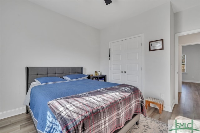 bedroom featuring a closet, ceiling fan, and hardwood / wood-style flooring