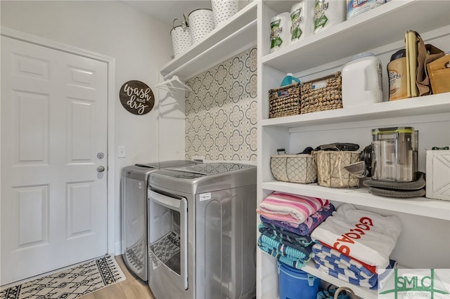 washroom featuring light hardwood / wood-style floors and independent washer and dryer