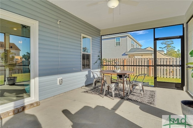 sunroom / solarium with ceiling fan