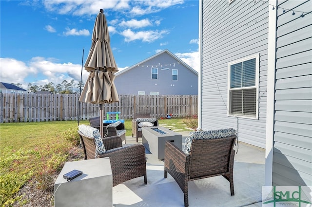 view of patio / terrace with an outdoor living space with a fire pit