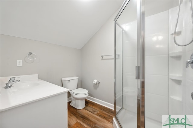 25 Harvest Moon Dr, Savannah, GA 31419 - bathroom featuring hardwood / wood-style floors, vanity, a shower with shower door, and lofted ceiling