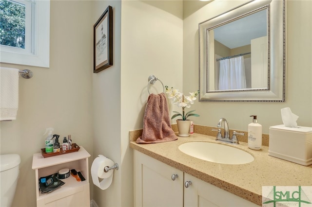 bathroom with vanity and toilet