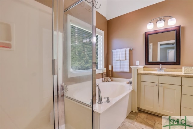 bathroom featuring vanity and shower with separate bathtub