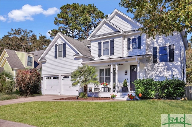 view of front facade with covered porch, a garage, and a front yard