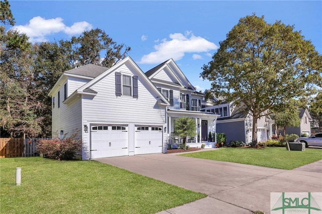 view of front facade with a front yard and a garage