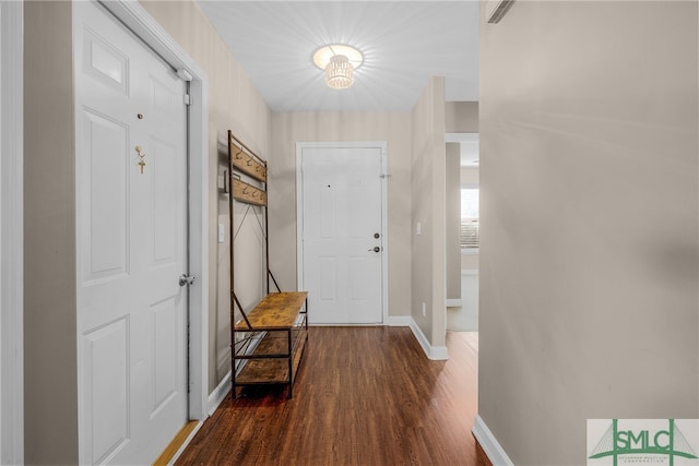 hall with dark hardwood / wood-style flooring