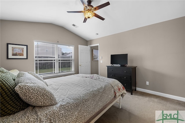 carpeted bedroom featuring ceiling fan and vaulted ceiling