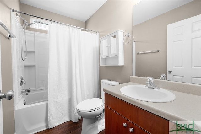 full bathroom featuring hardwood / wood-style flooring, vanity, toilet, and shower / bath combo