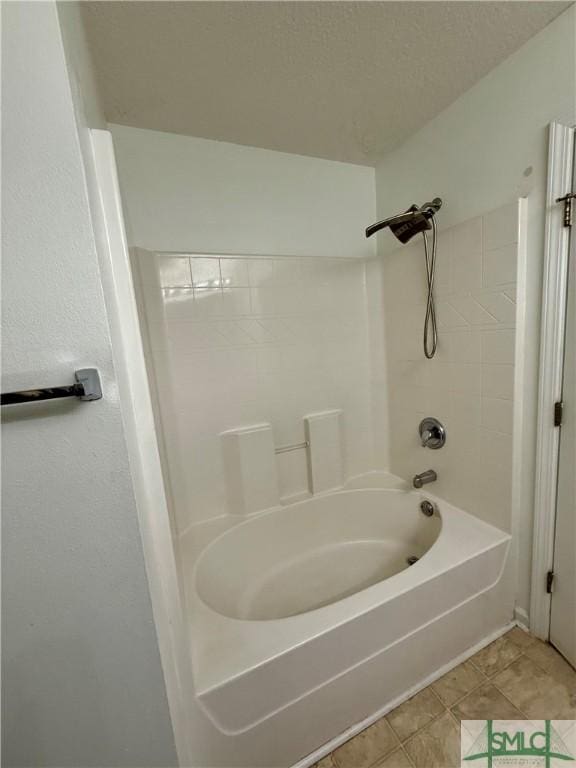 bathroom with tile patterned flooring and bathing tub / shower combination