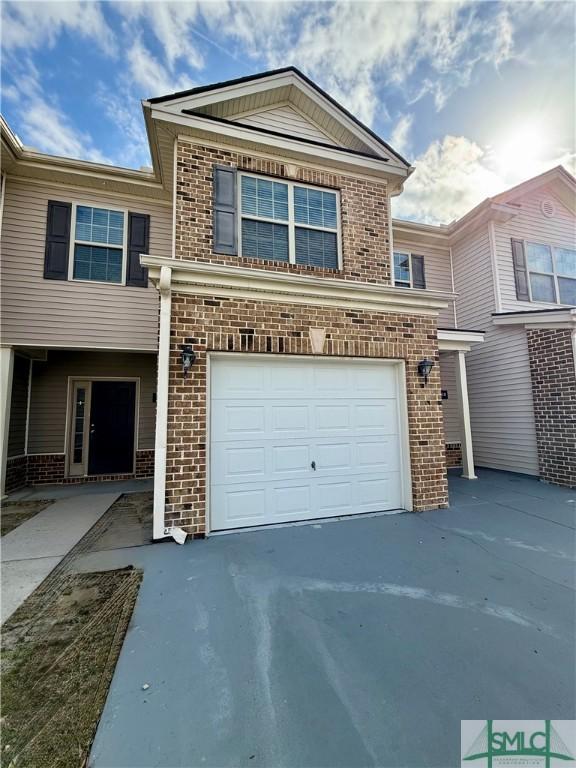 view of front of property with a garage