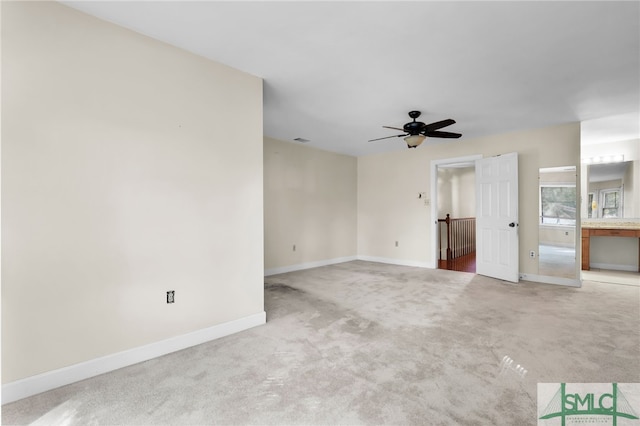 interior space featuring ceiling fan and light carpet