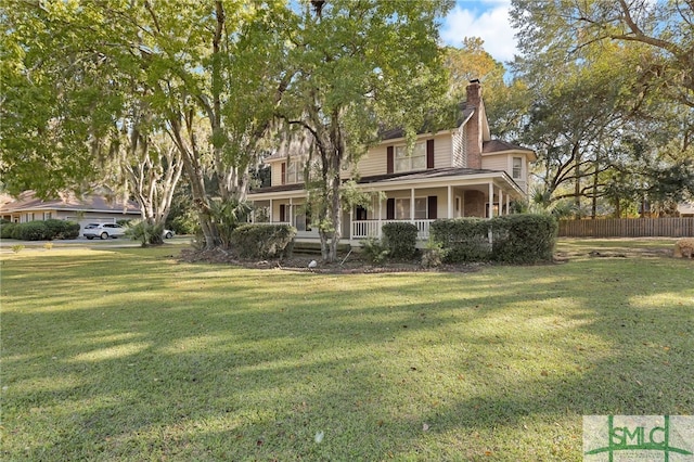 exterior space with a porch and a front yard