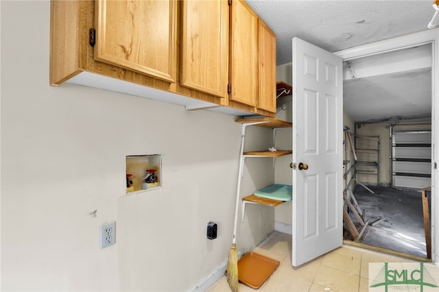 laundry room with cabinets and hookup for a washing machine