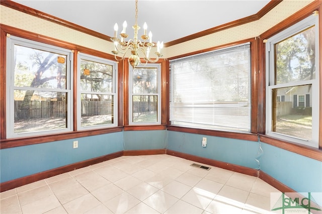 unfurnished sunroom featuring an inviting chandelier