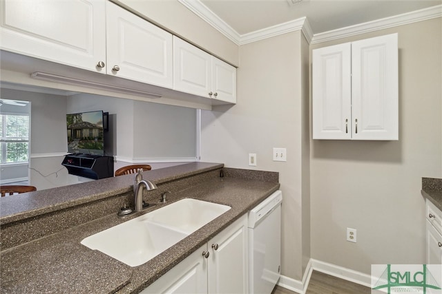 kitchen featuring hardwood / wood-style floors, white dishwasher, white cabinets, sink, and ornamental molding