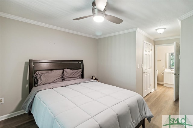 bedroom with ensuite bath, ceiling fan, crown molding, and hardwood / wood-style flooring