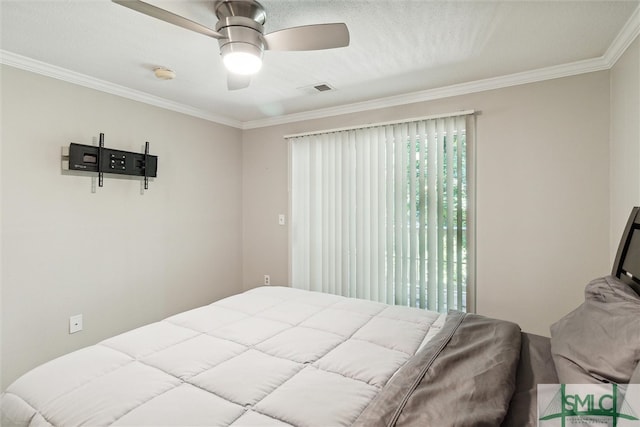 bedroom with ceiling fan and ornamental molding