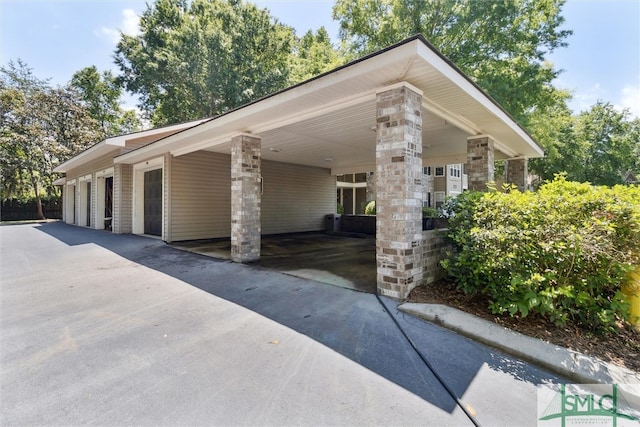 view of property exterior featuring a carport